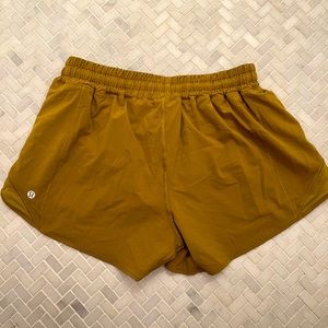 Lululemon Hotty Hot Low rise short- gold color, size 10 tall.